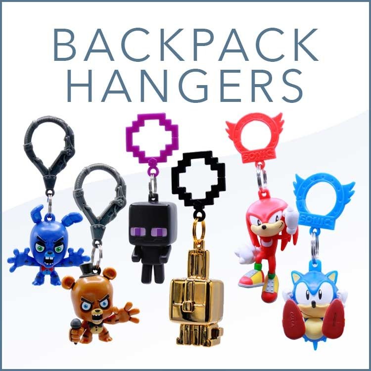 Just Toys clip-on backpack hangers displayed on a collector's shelf