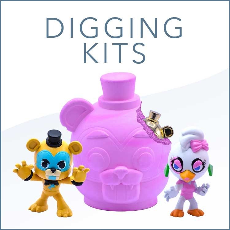 Just Toys blind bags, mystery capsules and dig kits on a collector's shelf